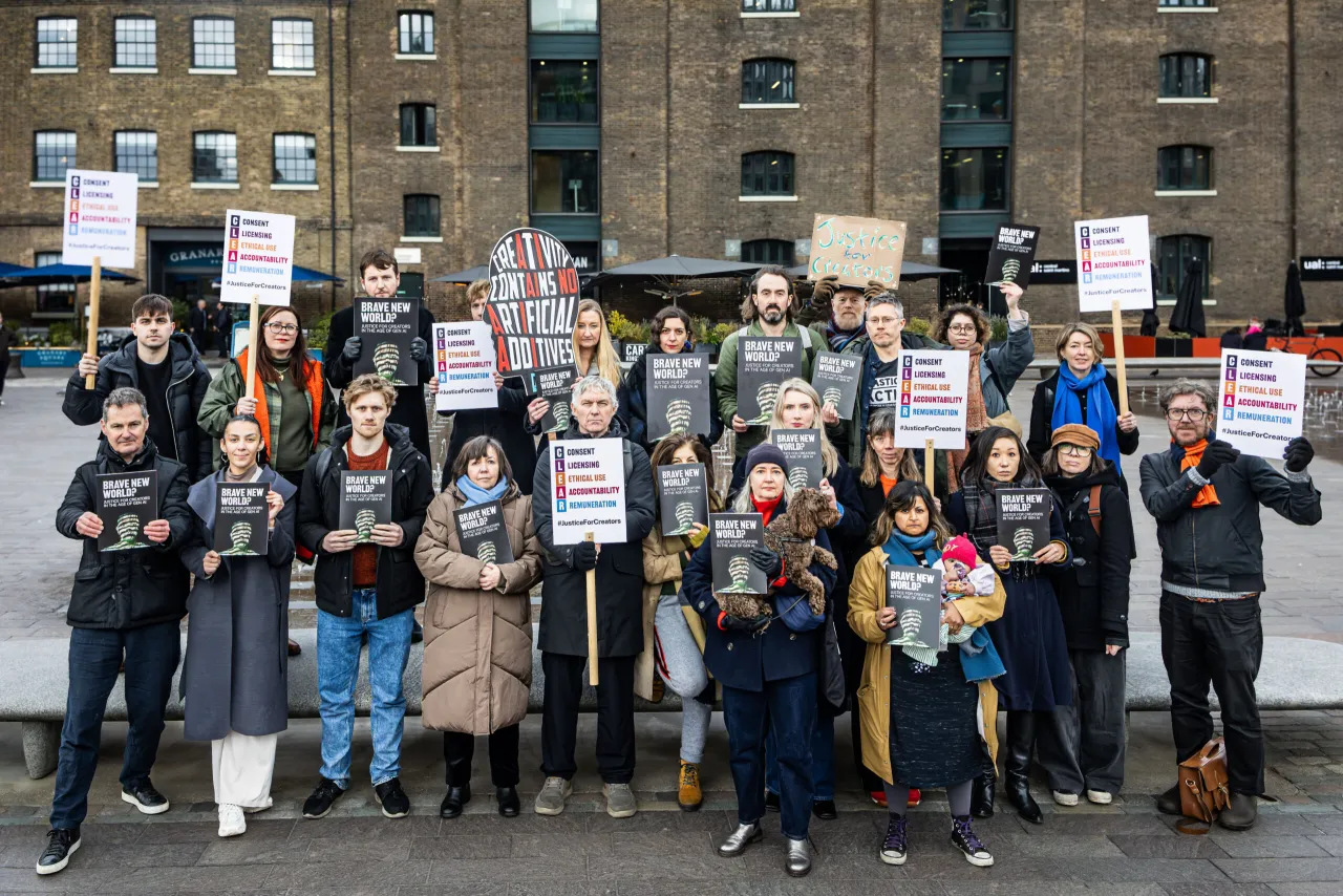 Creators taking a stand in Granary Square, King’s Cross. Including illustrators Benji Davies, Chris Haughton, Ged Adamson, Momoko Abe and Simona Ciraolo, and AOI Board Member Jhinuk Sarkar. Photograph © Ozzy Nada.