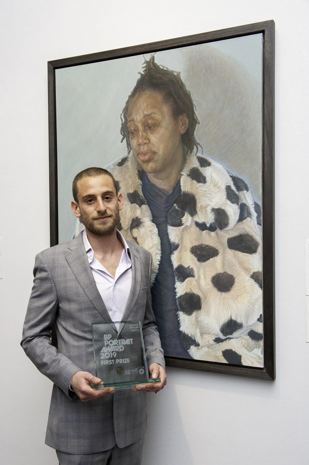 First Prize Winner Charlie Schaffer with his portrait Imara in her Winter Coat. Photograph by Jorge Herrera