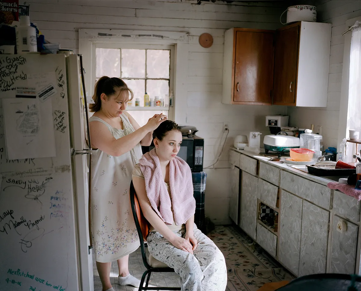 This photo was shot in a dying coal-mining town, St Charles, which is situated in the beautiful Appalachian Mountains behind the fog. © Hannah Modigh. Portrait Single Image Winner, Magnum and LensCulture Photography Awards 2016