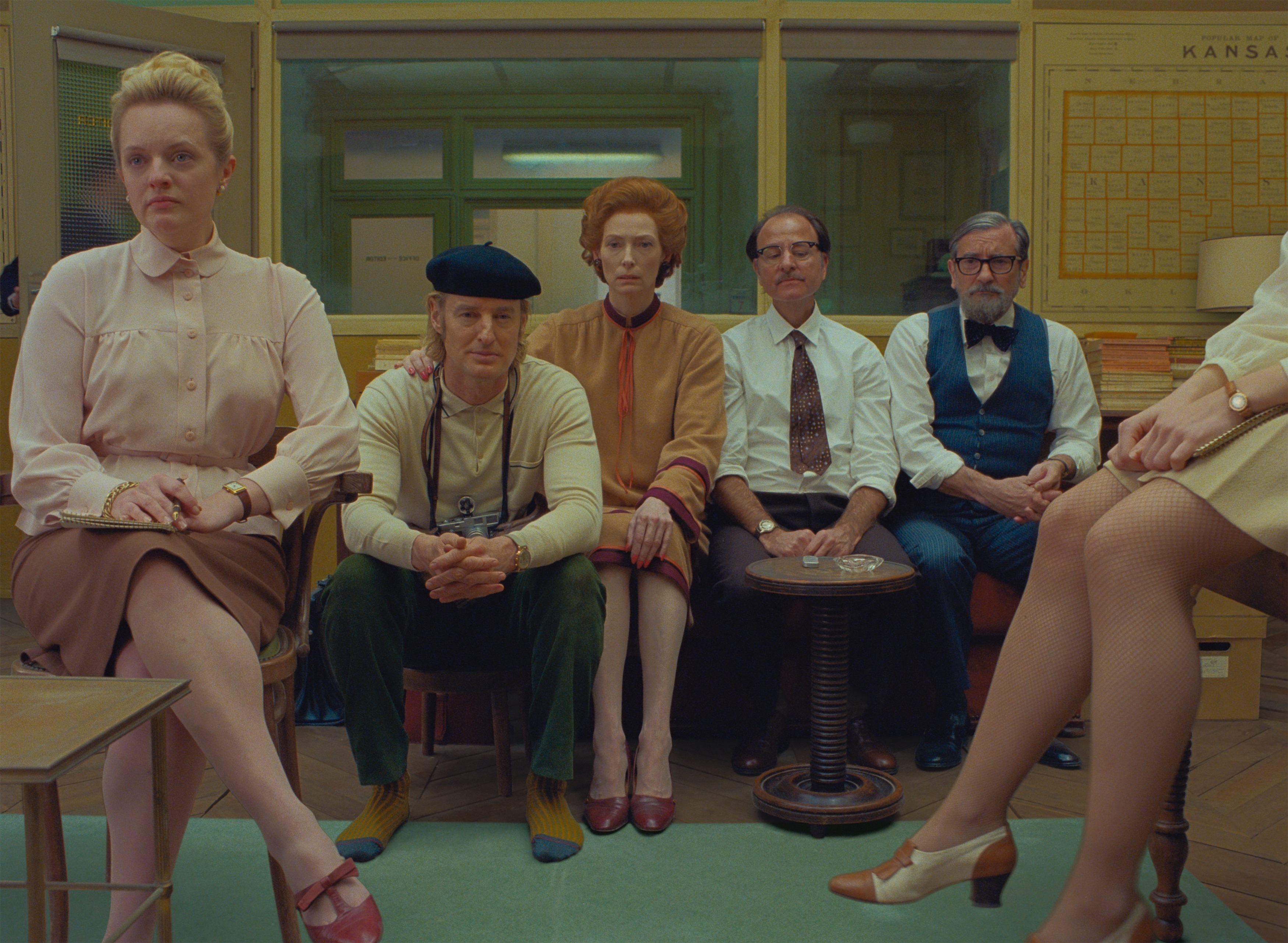 (From L-R): Elisabeth Moss, Owen Wilson, Tilda Swinton, Fisher Stevens and Griffin Dunne in the film THE FRENCH DISPATCH. Photo Courtesy of Searchlight Pictures. © 2021 20th Century Studios All Rights Reserved